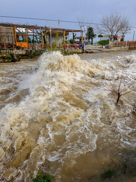Muddy river overflowing after heavy autumn rainfall