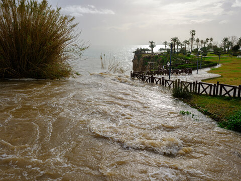 Muddy river overflowing after heavy autumn rainfall