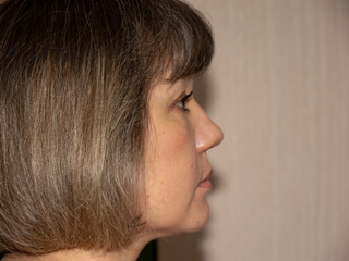 Side Profile of Woman With Short Brown Bob Haircut © Andrey