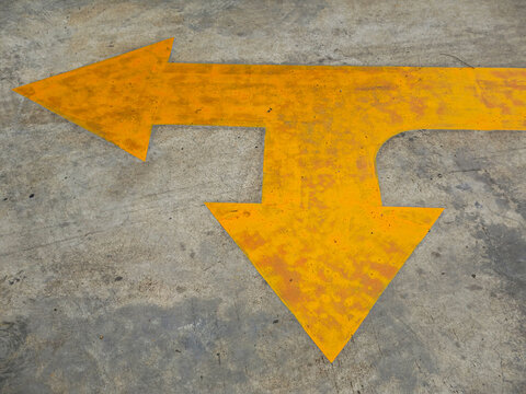 yellow arrow sign