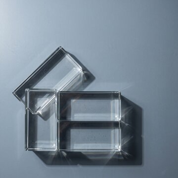 Transparent Glass Blocks on a Pale Blue Surface