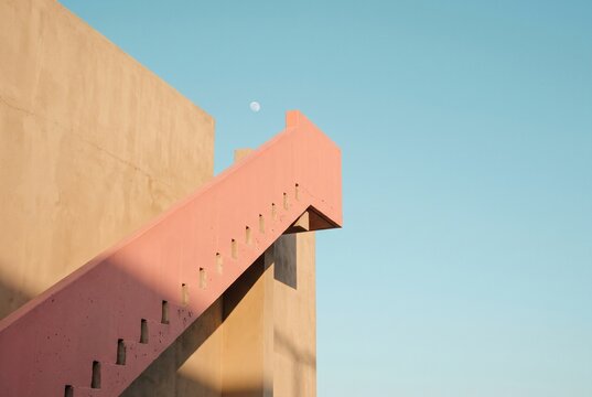 Pastel Geometric Staircase Against a Turquoise Sky