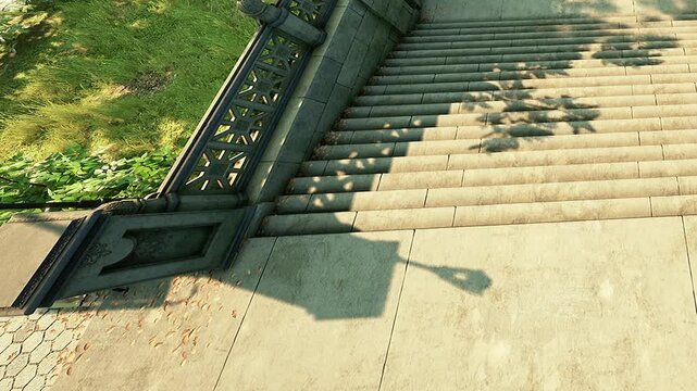 High angle view of wide stone stairs and a paved walkway outdoors on a sunny day with distinct shadows cast by trees and nearby structures
