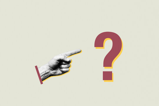 Human hand pointing finger at question mark symbol on minimalist background