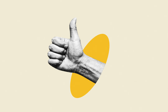 Hand showing thumbs up gesture emerging from yellow oval hole