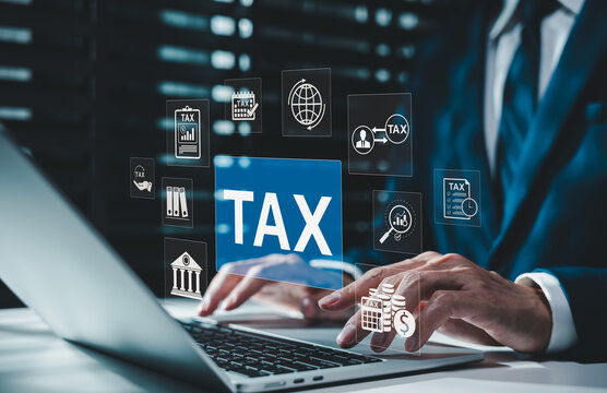 Tax accounting and corporate financial calculation concept. Businessman typing on laptop with icons of tax invoice form, calendar deadline, deduction coins, refund, online filing compliance system