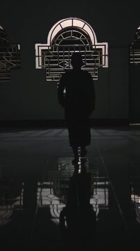 Silhouette of Person Walking in Mosque