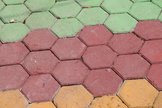 Colorful paving blocks installed on the ground create a durable decorative surface for outdoor pathways, gardens, sidewalks, and landscaping projects.