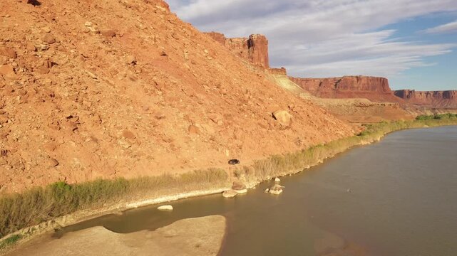 Aerial view of red rock canyon and river in desert landscape