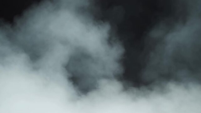 Drifting smoke plumes billow through a dark abstract atmosphere. Cinematic title sequences, horror and thriller productions, and dramatic promotional graphics.