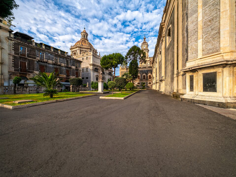 Sweeping Mediterranean travel photograph of Piazza Stesicoro with historic church domes in Catania, ideal for Sicilian travel guidebooks, urban prints, and tourism promotion.