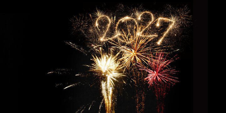 happy new year, new year's eve, silvester, new years eve, sparklers celebration greeting card, new year card - Year 2027 in sparkler font and firework fireworks pyrotechnic, dark night sky background