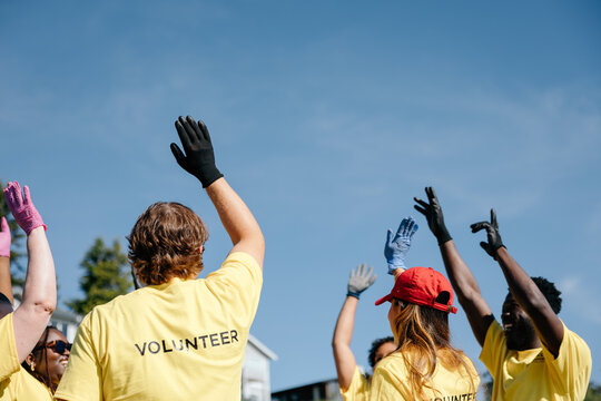 Volunteers celebrating after community beach cleanup