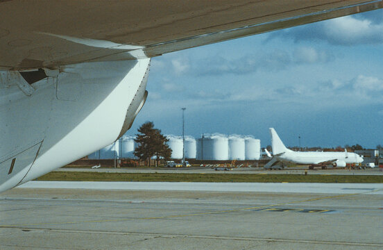 Airport Apron Beneath an Aircraft Wing