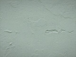 Green rough plastered wall showing abstract weathered cement texture background © Harry