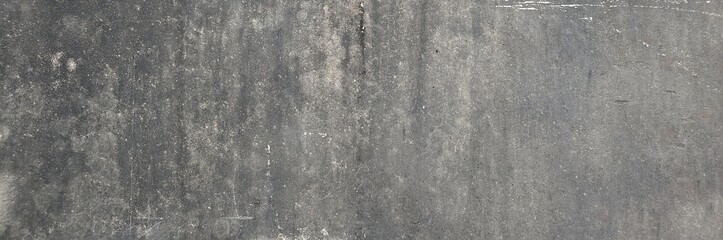 Dark gray concrete wall surface showing rough texture and abstract background © Harry