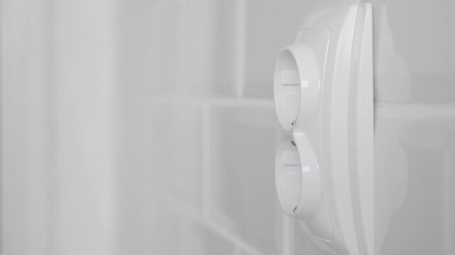 Shooting with a Man Disconnecting a Plug from the Electrical Outlet, Powering Off the Electricity of an Appliance at Home.