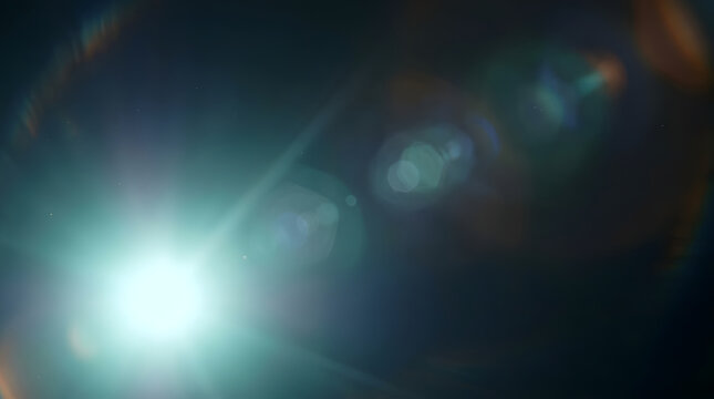 A bright white light source creates a dramatic lens flare effect with multiple circular bokeh reflections and colorful chromatic aberration streaks against a dark atmospheric background