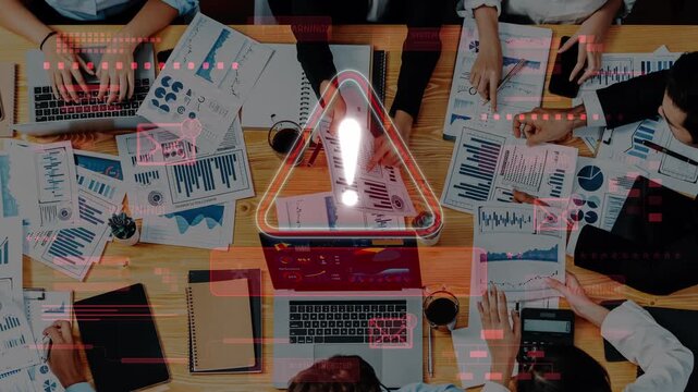 Team Meeting with Data Analysis and Security Alerts on Table Surrounded by Laptops, Charts, and Graphs, Highlighting Business Concerns. Raster.