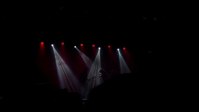 Slow Motion Concert Stage With Red and White Dramatic Light Beams