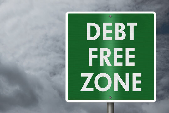 Green Debt free sign with stormy sky