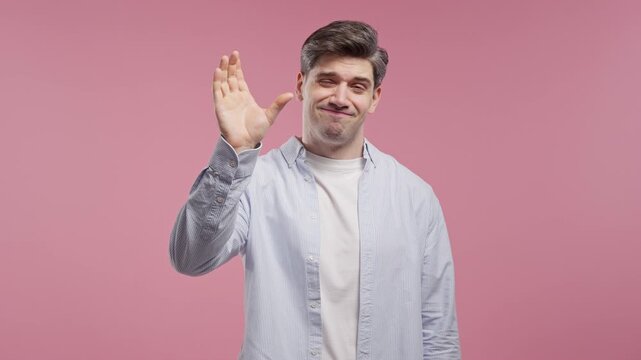 Adult Man Indicating Tiny Size With Fingers To Show Product Dissatisfaction.Small amount, limited quantity, budget, disappointing dimensions