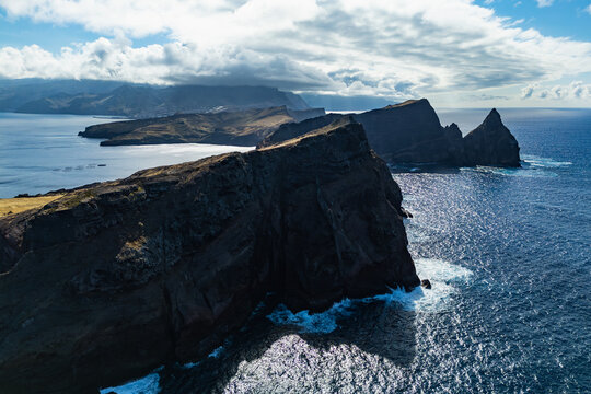 Atlantic Ocean coastline with steep cliffs at Sao Lourenco Peninsula, Madeira Island. Drone aerial view