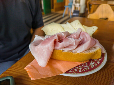 Cortina d&rsquo;Ampezzo, Italy. Fresh Ham Sandwich with Sliced Cheese in a Mountain Caf&eacute;