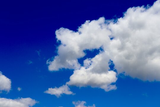The white clouds in the blue sky.