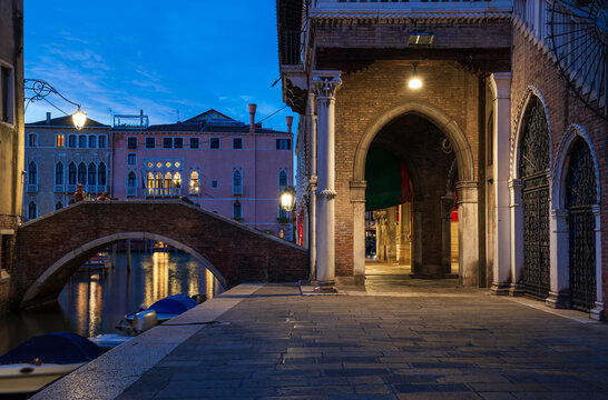 Night view of Rialto Market and fondamenta of Grand Canal in Venice, Italy. Architecture and landmarks of Venice. Cityscape of Venice.