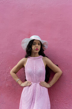 Woman in a Pink Dress and White Hat