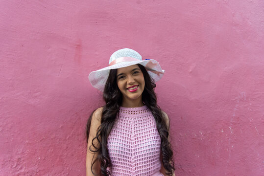Woman in a Pink Dress and White Hat