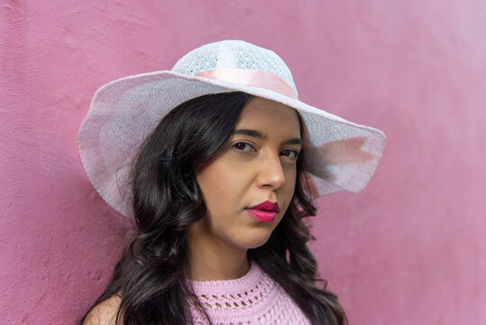 Portrait of a Woman with a Hat and Pink Dress