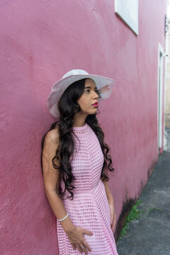 Woman in a Pink Dress and White Hat