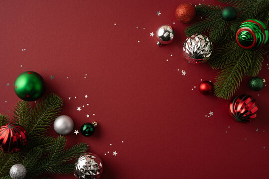 Festive Merry Christmas and Happy New Year background with red and green ornaments and fir branches