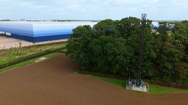 Aerial View of Telecommunications Mast Tower and Logistics Warehouses in Lutterworth UK