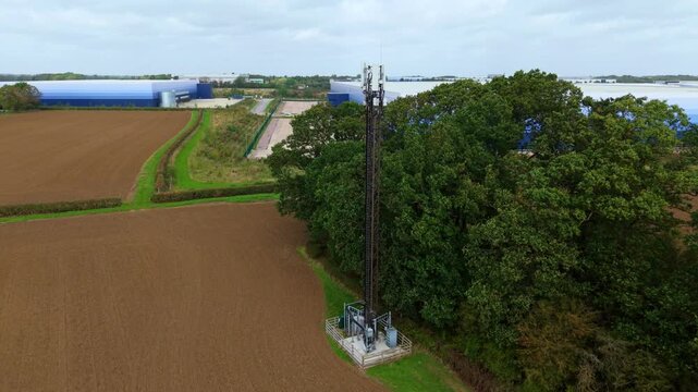 Aerial View of Telecommunications Mast Tower and Logistics Warehouses in Lutterworth UK
