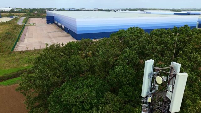 Aerial View of Telecommunications Mast Tower and Logistics Warehouses in Lutterworth UK