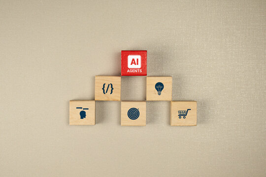 Technology and business icons on stacked wooden blocks. A top-down view representing AI agents and process automation.