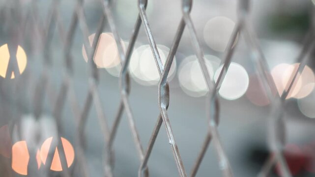 Traffic Lights Behind Chain Link Fence at Dusk