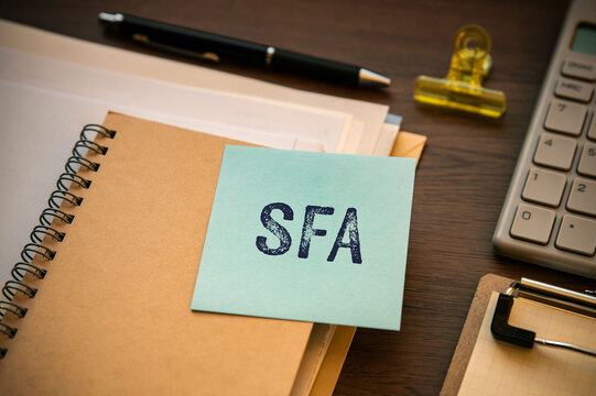 SFA reminder note on organized workspace &mdash; ideal eye-catcher for CRM and automation blog posts
