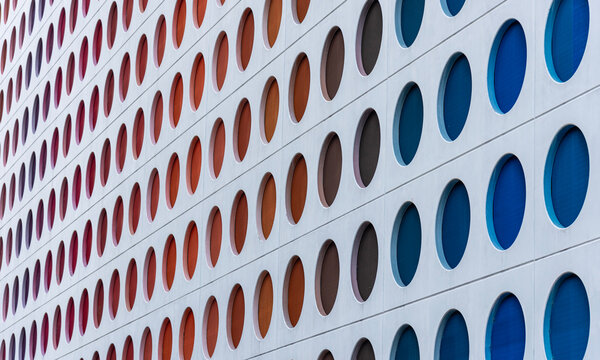 Modern building facade with colorful circular pattern