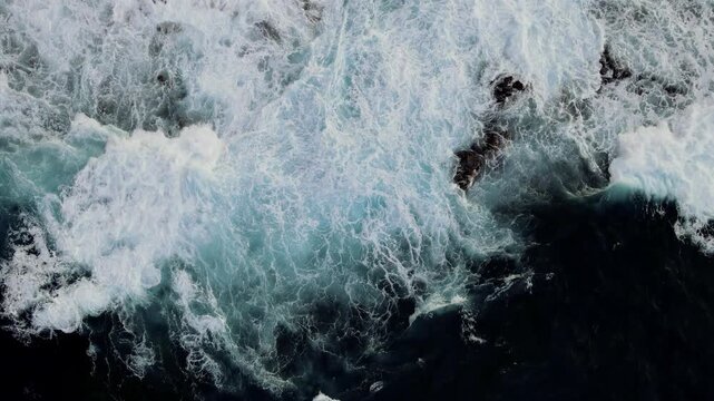 A darker water study near Los Chochos keeps almost no rock in frame with foam alone carrying the composition. A more minimal entry in this set of Tenerife overhead studies.