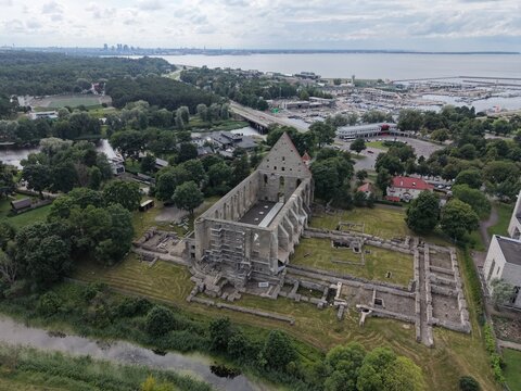 Aerial view of the historic Pirita Convent ruins, featuring the stone gable wall and archaeological foundations set within a green landscape, Tallinn, Harju maakond, Estonia.