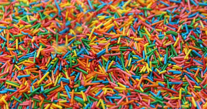 Many bright rainbow sprinkles. Decoration for dessert