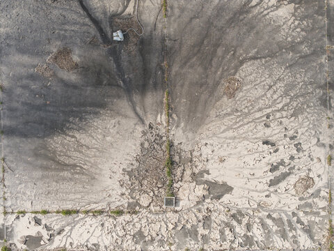 Aerial view of the Brushy Creek Wastewater Treatment Plant showing intricate sedimentation patterns, drainage channels, and industrial infrastructure in Chirnside Park, Victoria, Australia.