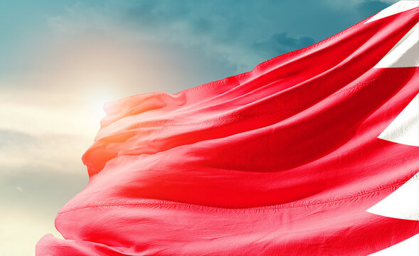 Bahrain flag waving with soft clouds.
