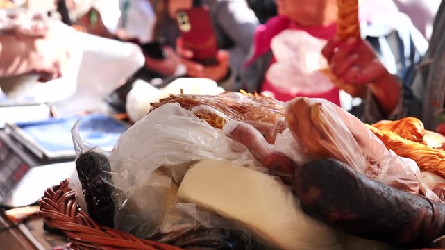 People shopping for fresh food at an outdoor street market stall