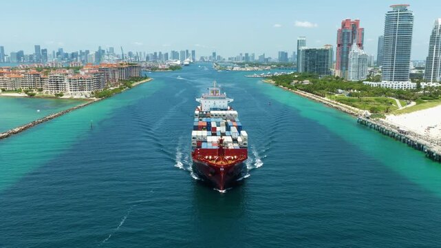 Miami, Florida, USA - May 16, 2025: Port of Miami. Cargo ship loaded with container in Miami, aerial. Freight container. Aerial Miami port with cargo container. Export and import