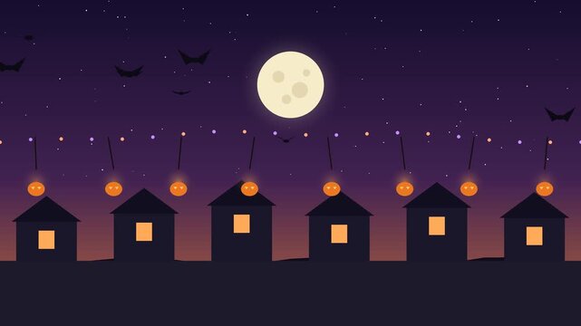 A halloween village glows under a full moon with flying bats in a nighttime scene houses